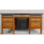 An early 20th Century oak and ebonised pedestal desk on square supports. H.76 W.153 D.89cm