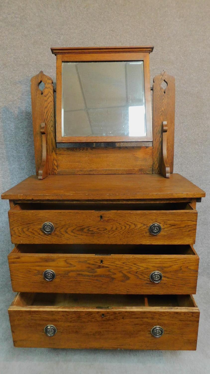 A late 19th century oak three drawer dressing chest with leaf carving and raised on bracket - Image 3 of 12