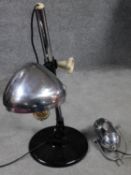 A pair of vintage adjustable chrome desk lamps on circular bases. One by Joseph Lucas Ltd and one