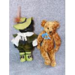 Antique musical plush humpback Teddy bear and vintage puss in boots doll. Teddy bear signs Teddy