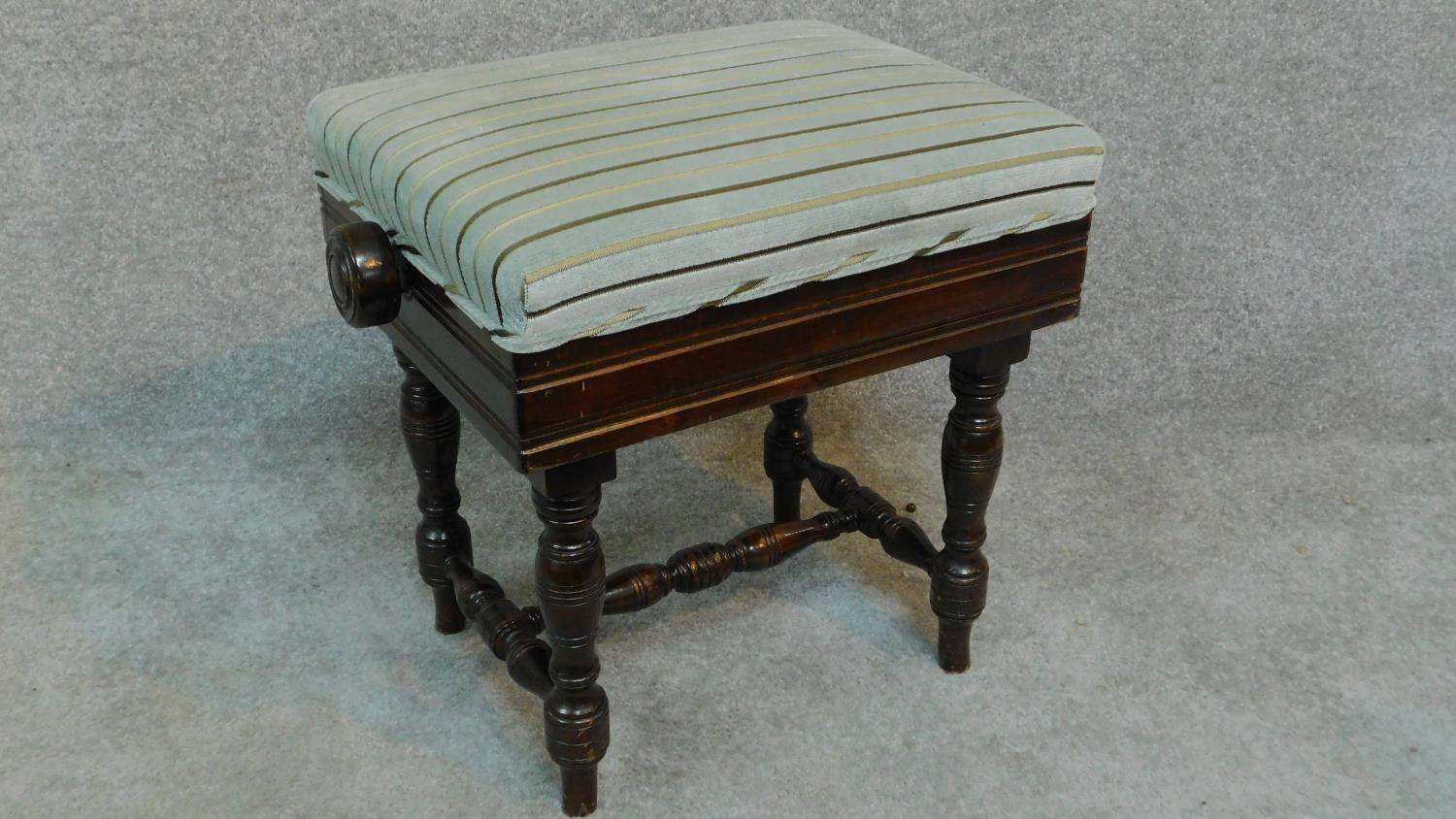 An Edwardian mahogany adjustable piano stool raised on stretchered turned tapering supports. H.46 - Image 2 of 6