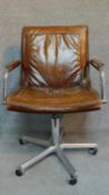 A Vintage leather office armchair on chromium base. H.94cm