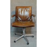A Vintage leather office armchair on chromium base. H.94cm