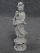 A vintage Blanc de Chine Quan Yin porcelain statue. Makers stamp to base. H.31cm