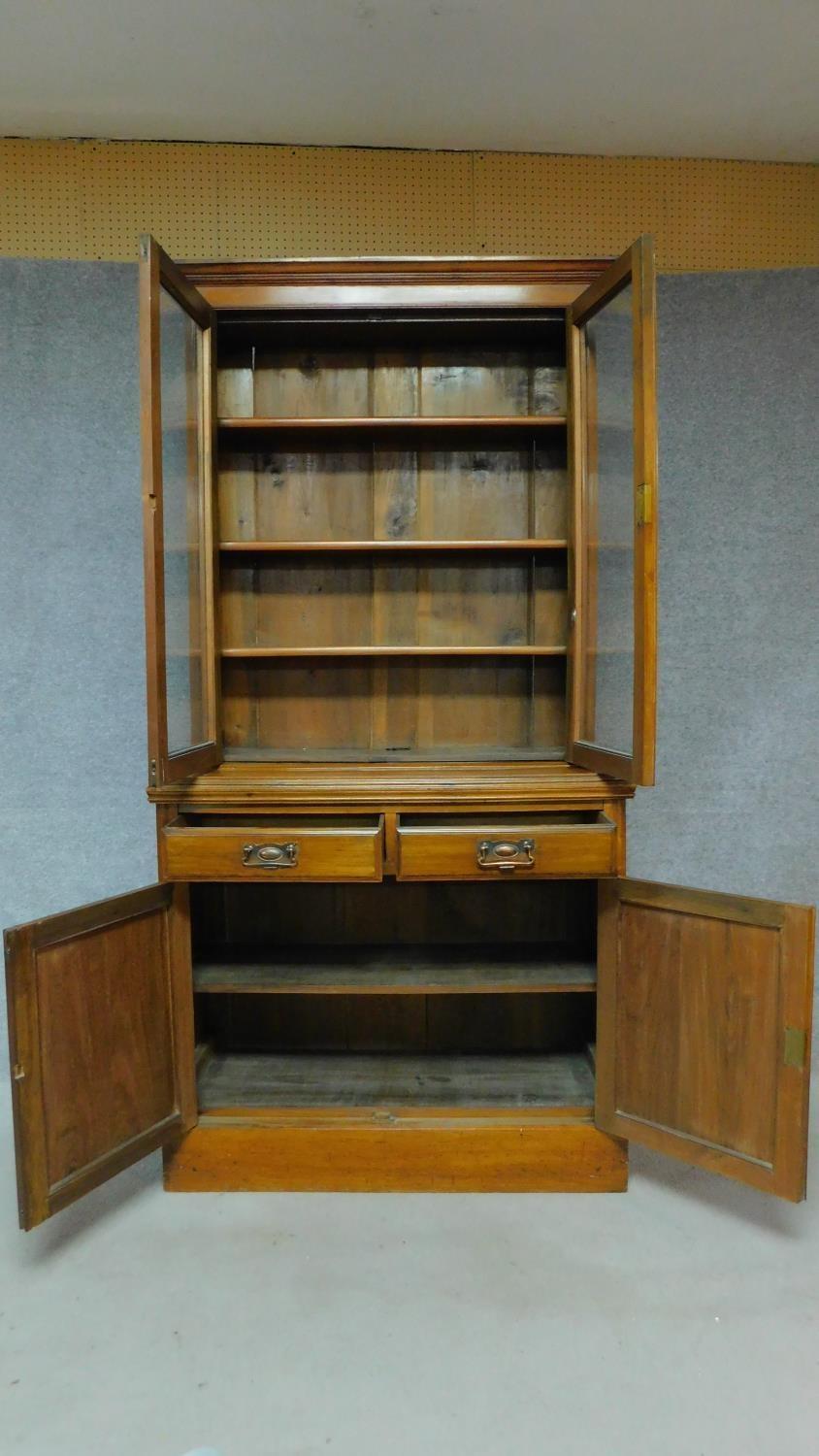 A Victorian oak library bookcase, the upper glazed section above panelled doors on plinth base. H. - Image 3 of 7