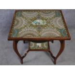 A late Victorian oak glass topped occasional table with inset collage made entirely from cigar