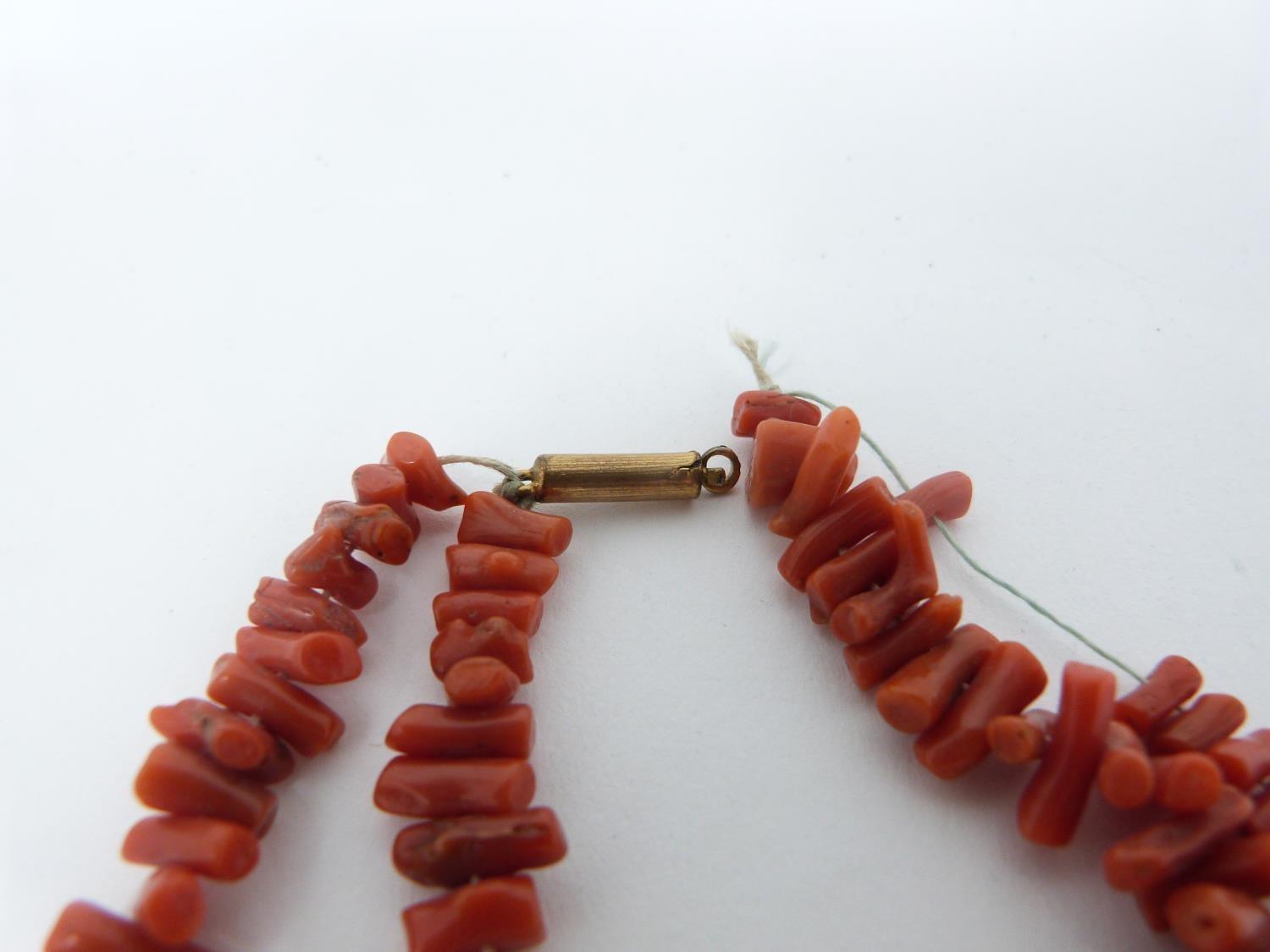 A collection of antique coral and gemstone necklaces. Including a Chinese goldstone necklace with - Image 4 of 20