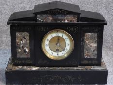 Victorian style black slate and marble mantle clock. With white enamel and brass dial. Engraved