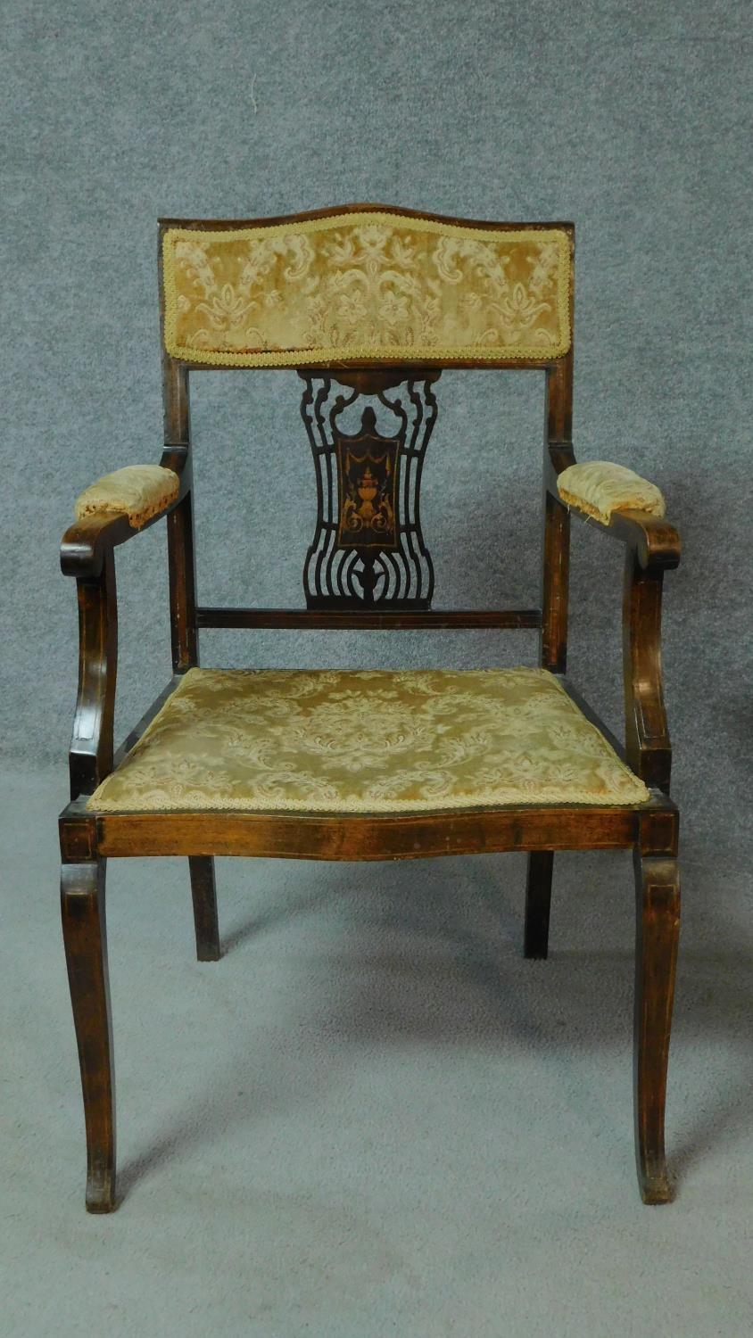 A late Victorian mahogany and satinwood inlaid armchair with urn design to the back, floral