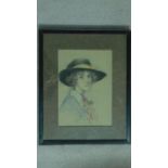 A framed and glazed pastel of a lady with a hat, unsigned. 51x41cm