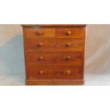 A Victorian flame mahogany chest of two short over three long drawers raised on plinth base. H.111