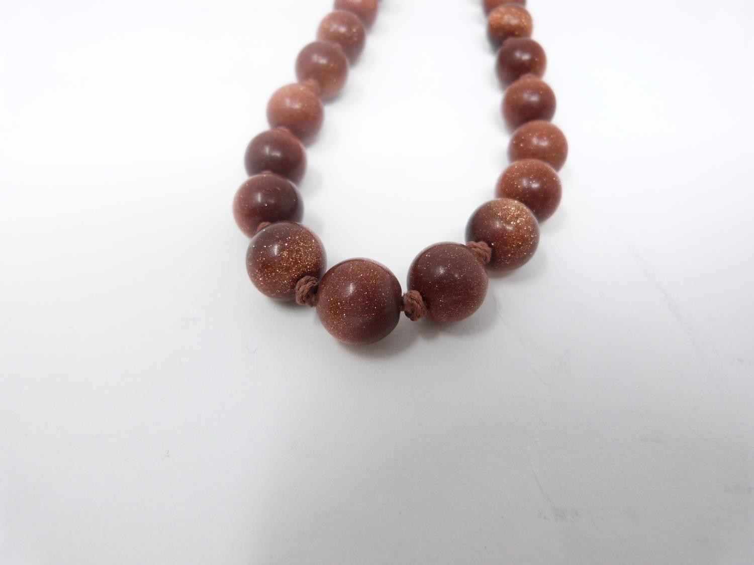 A collection of antique coral and gemstone necklaces. Including a Chinese goldstone necklace with - Image 6 of 20