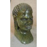 A vintage carved green jasper head of an African woman with braided hair. H.26cm