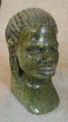 A vintage carved green jasper head of an African woman with braided hair. H.26cm