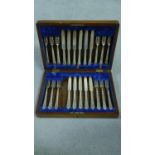 A Victorian oak cased canteen of silver plate cutlery by Levesley Brothers of Sheffield. Scrolling