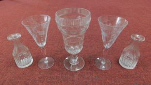 A Victorian engraved glass rummer along with two Victorian engraved trumpet shaped glasses and a