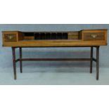 An early 20th Century mahogany converted piano writing desk raised on stretchered square supports.