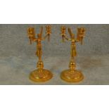 A pair of empire style gilded lady victory candle sticks. Each with two branches. H.28cm