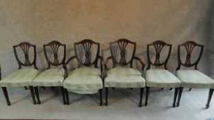 A set of six mahogany Hepplewhite style dining chairs in green striped upholstery raised on square