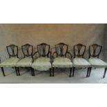 A set of six mahogany Hepplewhite style dining chairs in green striped upholstery raised on square