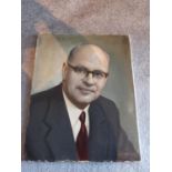 An oil on canvas portrait of a man in glasses, signed R.S Mendelssohn.