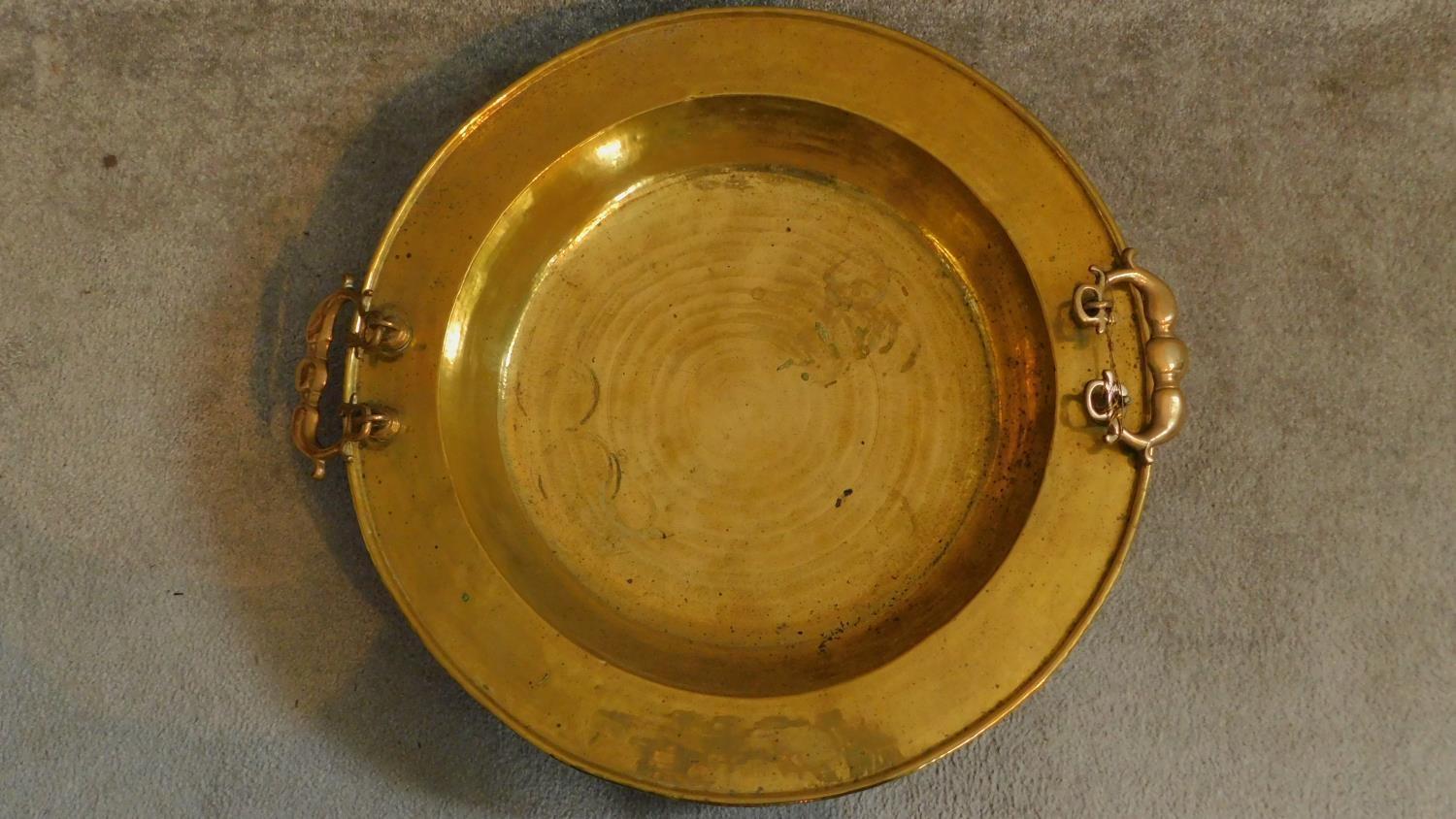 A large Oriental vintage beaten brass bowl with pair of swing handles. 65x65cm - Image 2 of 6
