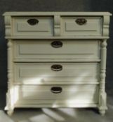 A 19th century Continental painted chest of two short over three long drawers flanked by turned