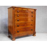 An early Victorian mahogany chest of five long drawers, top drawer fitted with secret compartment.