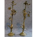 A pair of antique French gilded brass lily candelabras. H.53cm