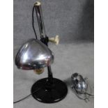 A pair of vintage adjustable chrome desk lamps on circular bases. One by Joseph Lucas Ltd and one