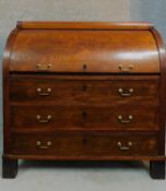 A 19th century Continental mahogany cylinder top bureau with tooled leather lined slide out