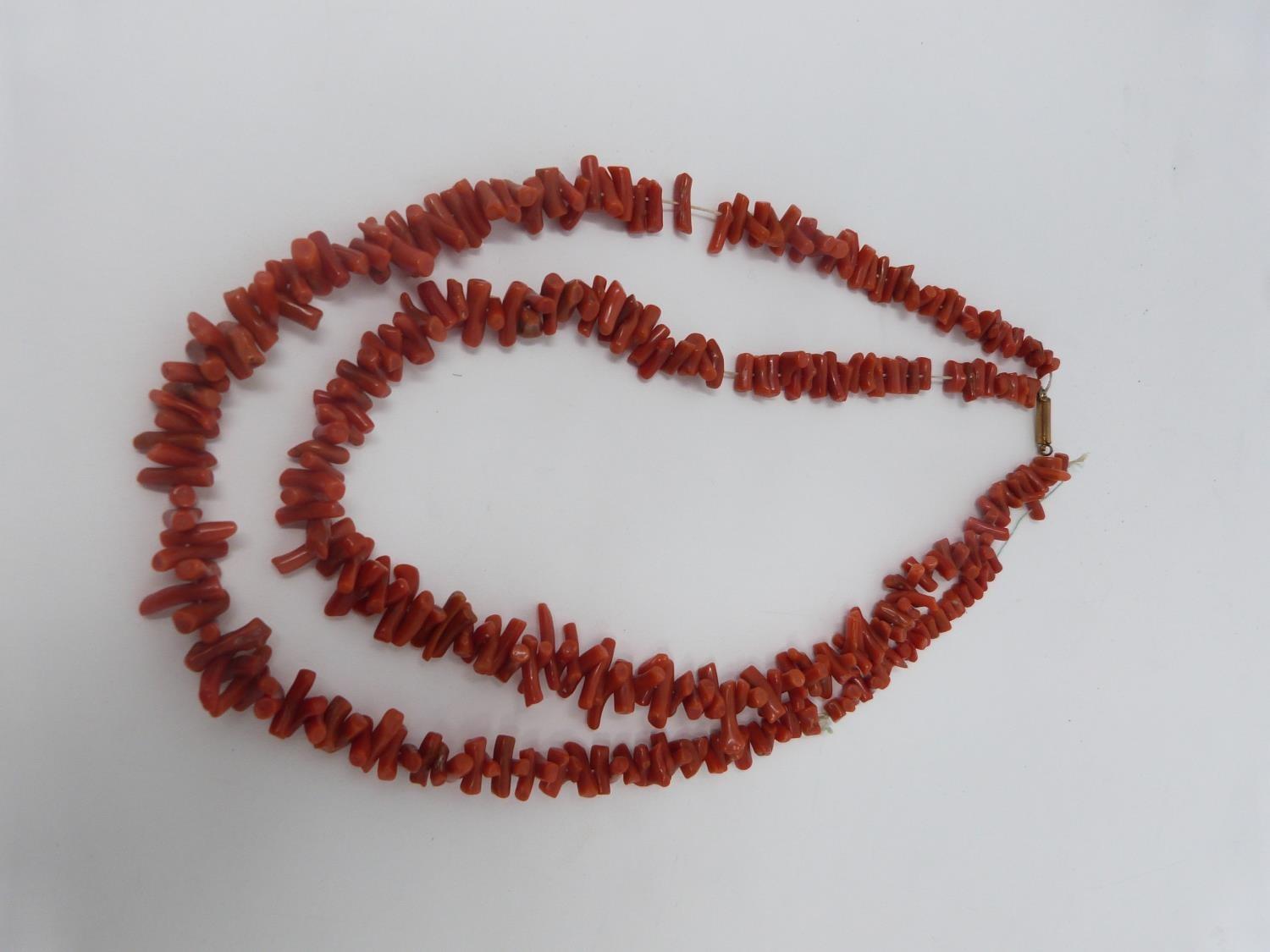 A collection of antique coral and gemstone necklaces. Including a Chinese goldstone necklace with - Image 2 of 20