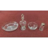 A collection of antique glass including an engraved decanter with stopper, star cut base plate,