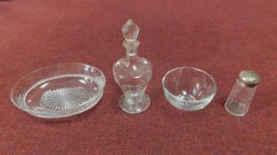 A collection of antique glass including an engraved decanter with stopper, star cut base plate,