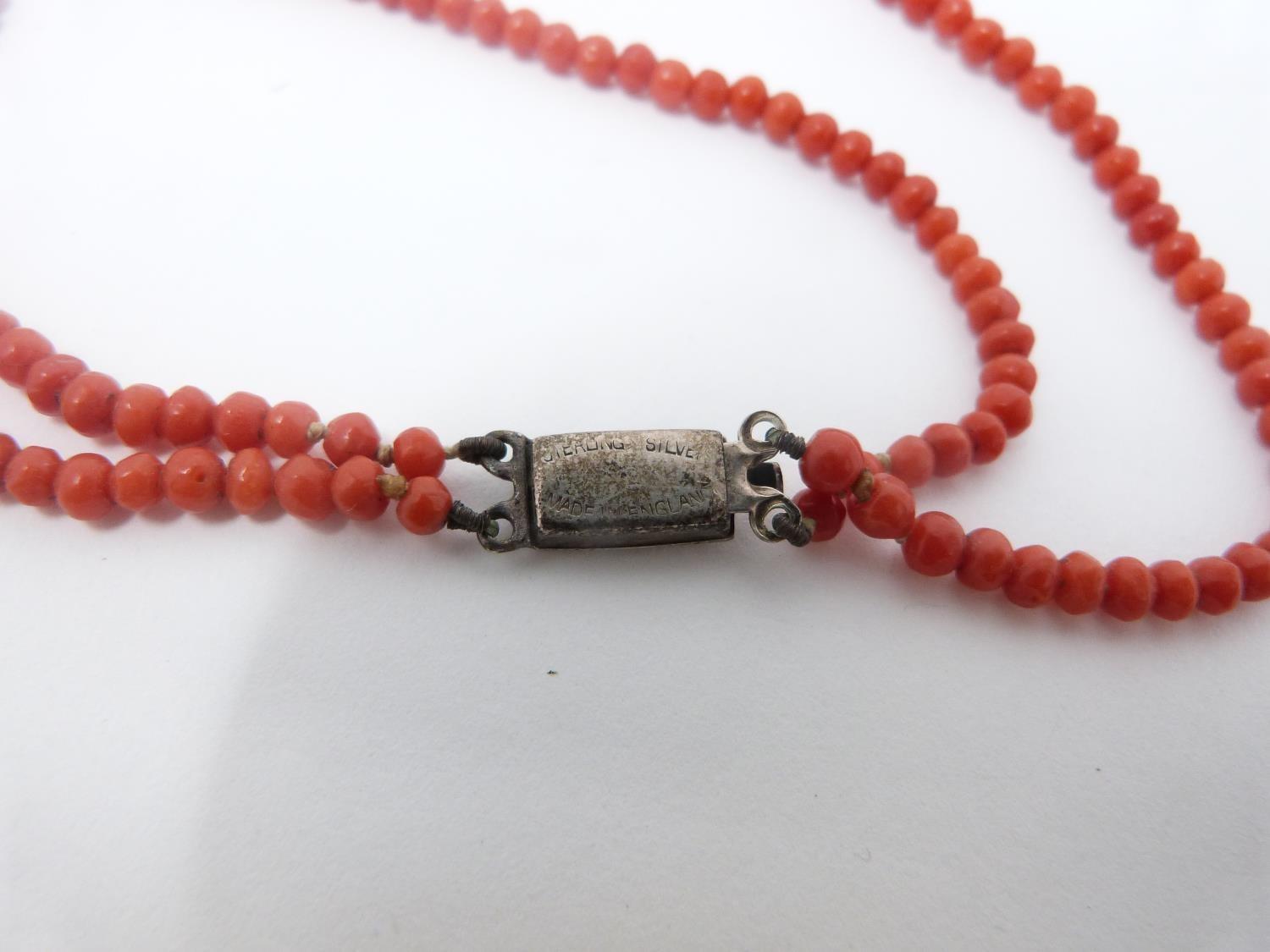 A collection of antique coral and gemstone necklaces. Including a Chinese goldstone necklace with - Image 11 of 20