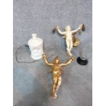 A collection of items, including two plaster cherub light fittings, one gilded, a carved alabaster