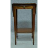 An Edwardian mahogany and satinwood inlaid drop leaf table with frieze drawer, fitted with under