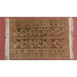 A Persian rug with double pole medallion, geometric motifs, surrounded by repeating stylised borders