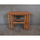 A vintage nest of three graduating beech occasional tables. H.53 x 66cm