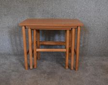 A vintage nest of three graduating beech occasional tables. H.53 x 66cm