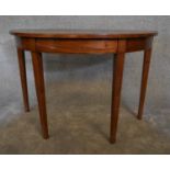 A Georgian mahogany demi lune console table. H.72 x 52cm