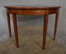 A Georgian mahogany demi lune console table. H.72 x 52cm