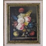 A gilt framed oil on, still life flowers. 39cm x 43cm.