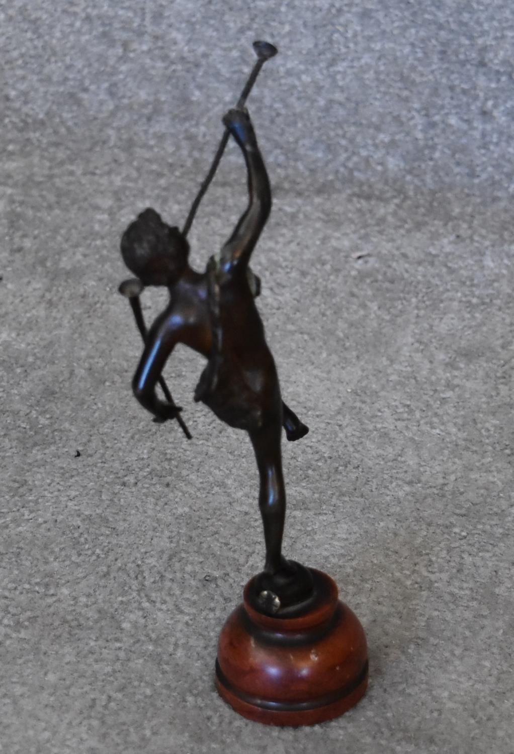 A 19th century bronze figure of Peter Pan on rouge marble circular base, signed. H.15cm - Image 2 of 5