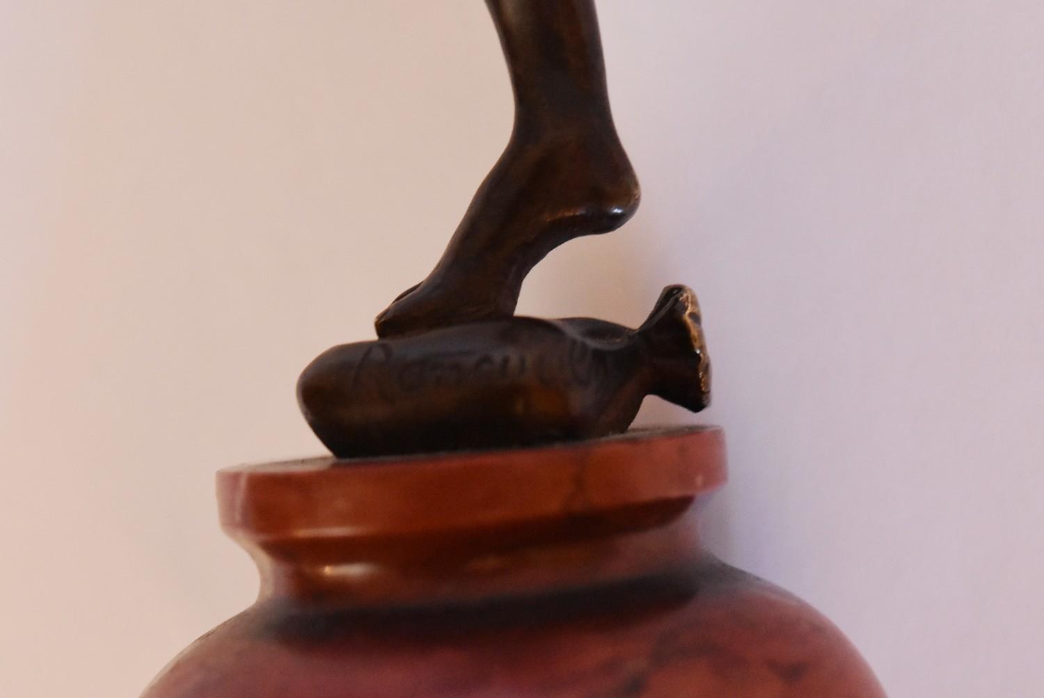 A 19th century bronze figure of Peter Pan on rouge marble circular base, signed. H.15cm - Image 4 of 5