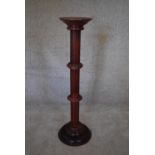 A 19th century style mahogany torchere. H.97 x 22cm