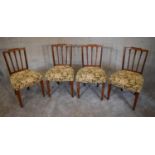 A set of four late 19th century Georgian style dining chairs with stuff over floral seats. H. 89 x