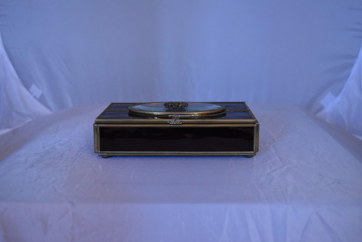 A vintage purple and clear stained glass panel and brass jewellery box. Mirrored panel to the bottom