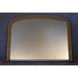 A Victorian style arched top gilt framed overmantel mirror. H.82 x 110cm