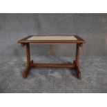 A mid 20th century teak low table with inset floral tiles. H.36 x 42cm